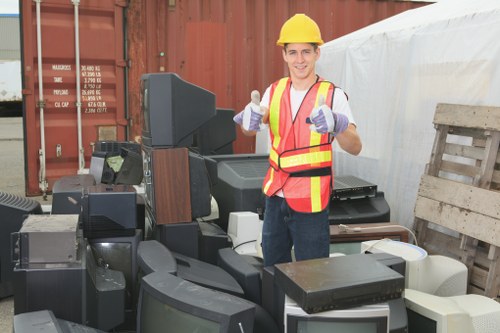 A team clearing old furniture from a residential home in Purley